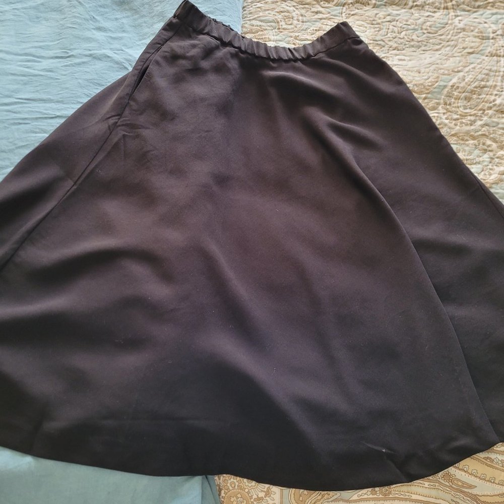 Black Pull On Skirt. Size 10. Made of Rayon and Polyester.